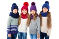 Group of cute kids in winter warm hats and scarfs on white. Children winter clothes Royalty Free Stock Photo