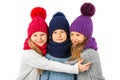 Group of cute kids in winter warm hats and scarfs on white. Children winter clothes Royalty Free Stock Photo