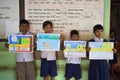 Group of cute little preschol kids display their drawing