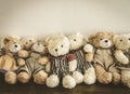 A group of cute teddy bears sitting together Royalty Free Stock Photo