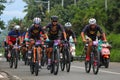 Group of cycling race to the mountain tag team