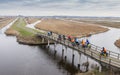 Group of cyclist crossing a bridge