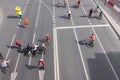 Group of cyclist people at active cycling sport festival race city road aerial view