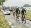 Group of Cyclists on a Cobblestone Road - Tour de France 2014 Royalty Free Stock Photo