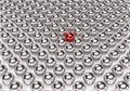 A group of 3d silver balls with unique one red ball on isolated background Royalty Free Stock Photo