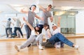 Group of dancing teenagers posing in dance studio Royalty Free Stock Photo