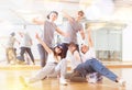 Group of dancing teenagers posing in dance studio Royalty Free Stock Photo