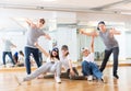 Group of dancing teenagers posing in dance studio Royalty Free Stock Photo