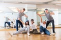 Group of dancing teenagers posing in dance studio Royalty Free Stock Photo