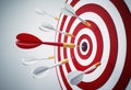 Group of darts hitting a red and white dartbord Royalty Free Stock Photo