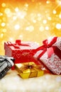 Group decorative gift boxes Golden bokeh front view vertical com Royalty Free Stock Photo