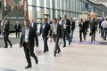 A group of delegates is walking in the Expoforum lobby.