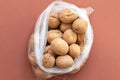 Group of walnuts on brown background in a plastic bag Royalty Free Stock Photo