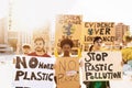 Group demonstrators protesting against plastic pollution and climate change - Multiracial people fighting on road holding banners Royalty Free Stock Photo