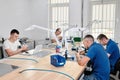 Group dental technicians working in a dental laboratory. Production of dental crowns Royalty Free Stock Photo