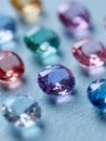 A group of different colored gems on a blue surface Royalty Free Stock Photo