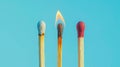 Group of different matches, some burning, pastel blue background, leadership, idea generation, teamwork. Generative AI Royalty Free Stock Photo