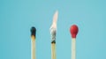 Group of different matches, some burning, pastel blue background, leadership, idea generation, teamwork. Generative AI Royalty Free Stock Photo