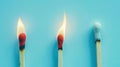 Group of different matches, some burning, pastel blue background, leadership, idea generation, teamwork. Generative AI Royalty Free Stock Photo