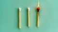 Group of different matches, some burning, pastel blue background, leadership, idea generation, teamwork. Generative AI Royalty Free Stock Photo