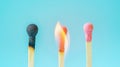 Group of different matches, some burning, pastel blue background, leadership, idea generation, teamwork. Generative AI Royalty Free Stock Photo