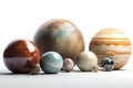 a group of different sized and colored planets on a white surface with a white back ground and a white back ground with a white