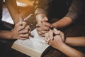 Group of different women praying together