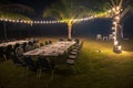 group dinner by beach with light decoration Royalty Free Stock Photo