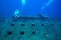 Group of divers explore shipwreck. Royalty Free Stock Photo