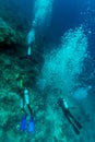 Group of divers going deep Royalty Free Stock Photo