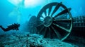 A group of divers swimming near a large turbinelike structure underwater. The caption explains that the structure is a