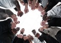 Group of diverse ambitious young people standing in a circle Royalty Free Stock Photo