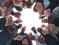 Group of diverse ambitious young people standing in a circle Royalty Free Stock Photo