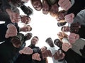 Group of diverse ambitious young people standing in a circle Royalty Free Stock Photo