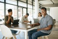 Group of diverse business people working in an office. Happy smiling business man leader manager looking at the camera Royalty Free Stock Photo