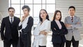Group of diverse businesspeople  Asian and Caucasian teamwork standing and cross their arms and looking to camera. Idea for multi- Royalty Free Stock Photo