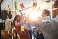 Diverse businesspeople high fiving together after a brainstormin Royalty Free Stock Photo