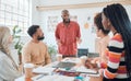 Group of diverse businesspeople having a meeting in a modern office at work. Young african american businessman doing a Royalty Free Stock Photo