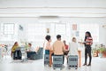 Group of diverse businesspeople having a meeting in a modern office at work. Young happy african american businesswoman Royalty Free Stock Photo