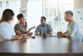 Group of diverse businesspeople having a meeting in an office at work. Happy african american businesswoman talking Royalty Free Stock Photo