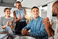 Group of diverse businesspeople having a meeting in an office at work. Happy business professionals clapping for their Royalty Free Stock Photo