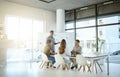 Group of diverse businesspeople having a meeting in an office at work. Young african american businessman talking while Royalty Free Stock Photo