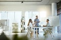 Group of diverse businesspeople having a meeting in an office at work. Young african american businessman talking while Royalty Free Stock Photo