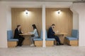 Group of diverse businesspeople working seated in modern co-working office Royalty Free Stock Photo