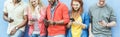 Group of diverse culture friends watching smart mobile phones - Young people addiction to new technology trends - Concept of youth Royalty Free Stock Photo