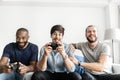 Group of diverse friends having vdo competition game