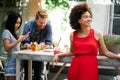 Group of diverse friends talking and having fun at cafe outdoor Royalty Free Stock Photo