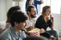 Group of diverse friends watching movie together Royalty Free Stock Photo