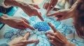 A group of diverse hands pointing at a drawing of a brain The image represents the concept of brainstorming and teamwork Royalty Free Stock Photo