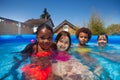 Group small kids friends in swimming pool together Royalty Free Stock Photo